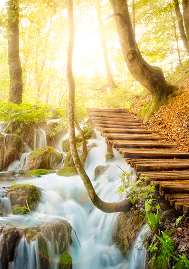 Wooden path over waterfall